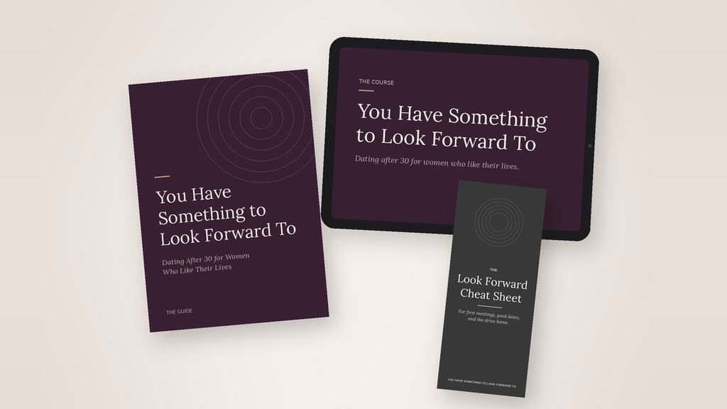 A digital mockup showing a dark purple booklet, a tablet, and a dark gray cheat sheet with motivational and self-help text on a light beige background.